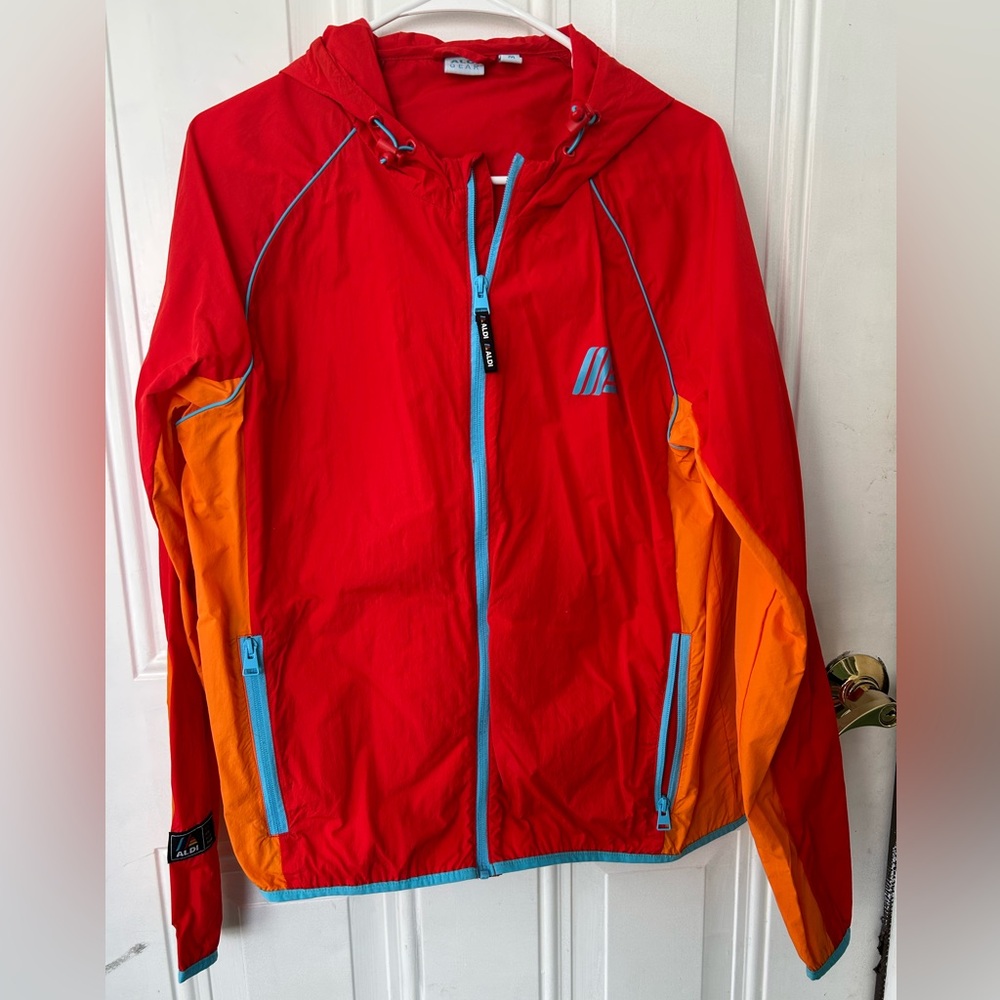 Aldi’s Raincoat Red and Orange Hooded Jacket with Blue Accents